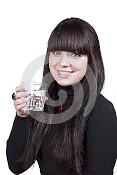 Brunette smiling girl with glass of water, isolated