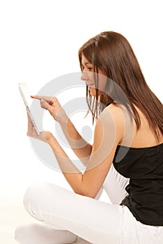 Brunette with tablet touch pad in hands