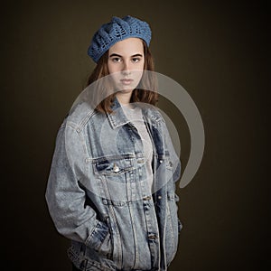 Brunette Teenage Girl Wearing Blue French Wool Barret and Denim