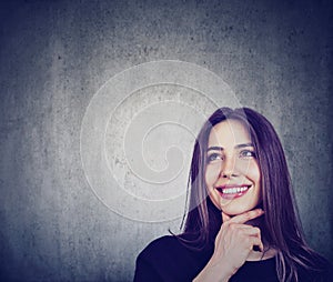 Brunette thoughtful woman smiling looking up