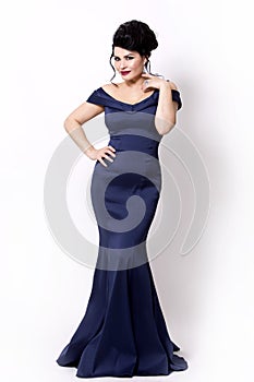 Brunette wearing navy long evening gown