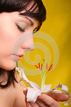 Brunette with white lily flowers