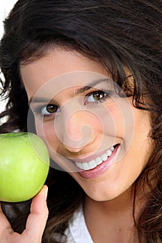 Brunette woman and an apple