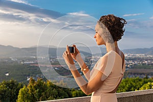 Brunette woman curly hair girl takes selfie photo