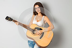 Brunette woman with guitar