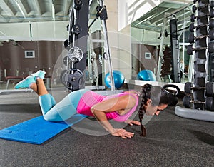 Brunette woman at gym knees push up push-up