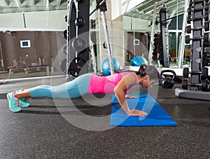 Brunette woman at gym push up push-up