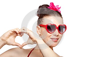 brunette woman in heart-shaped glasses