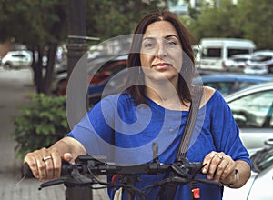 Brunette Woman on her Electric Scooter