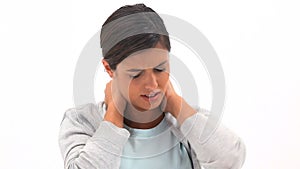 Brunette woman holding her painful neck