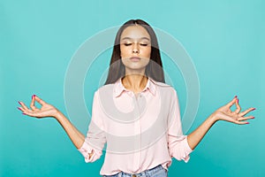 Brunette woman in a keep calm pose . Having a rest and meditating concept.