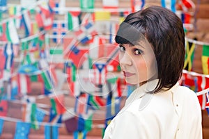 Brunette woman looking over her shoulder back against