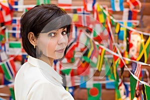 Brunette woman looking over her shoulder back against