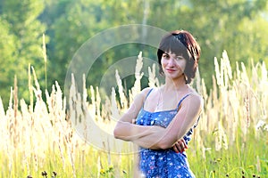 Brunette woman on meadow