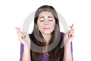 Brunette woman pray and hope with closed eyes