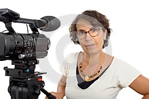 Brunette woman with professional video camera, on white