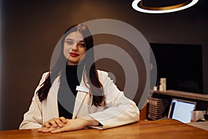 Brunette woman receptionist working in Reception