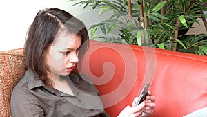 Brunette woman sending a text message