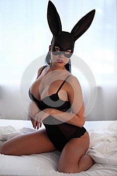 Brunette woman with lingerie and fluffy bunny ears