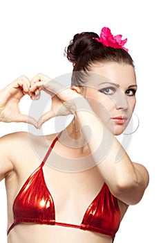 brunette woman showing heart shape