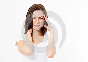 Brunette Woman suffering from stress or headache grimacing in pain as she holds the back her neck with her other hand