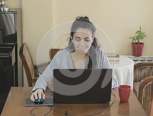 Brunette woman teleworking at home