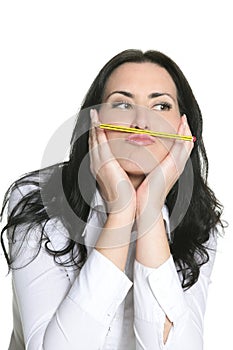 Brunette woman thinking with pencil