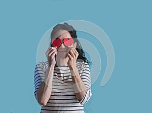 Brunette woman with two hearts in her eyes