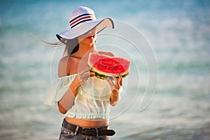 Brunette woman watermelon sea