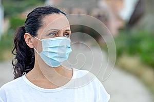 Brunette woman wearing a mask