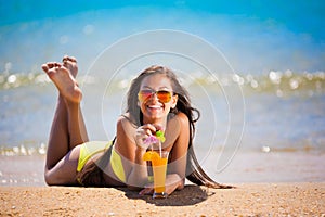 Brunette woman yellow swimsuit drink cocktail