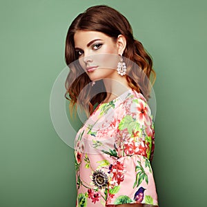 Brunette young woman in floral spring summer dress