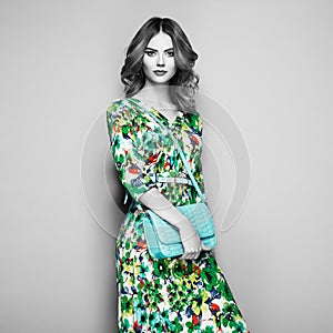 Brunette young woman in floral spring summer dress