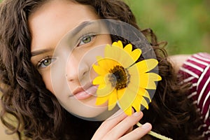 Brunetter high school senior girl with sunflower