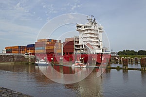 Brunsbuettel - Container vessel at lockage to the Kiel Canal