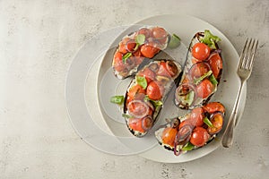 Bruschetta with cherry tomatoes and cheese cream. Healthy, vegan food, snack. Copy space