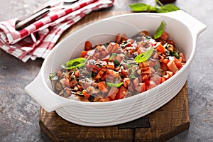 Bruschetta chicken with cheese, fresh tomatoes and basil