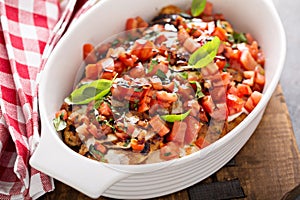 Bruschetta chicken with cheese, fresh tomatoes and basil