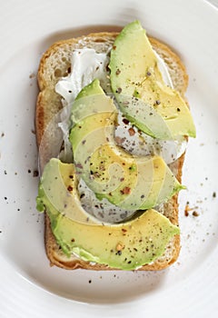 bruschetta with cream cheese and avocado in a plate close-up
