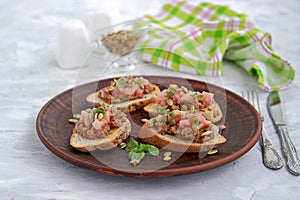 Bruschetta with duck confit pate, apple chutney and caramelized pumpkin seeds