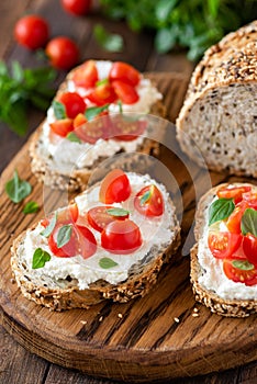 Bruschetta with fresh ricotta cheese and cherry tomatoes