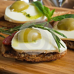 Bruschetta with tomato, mozarella and olive