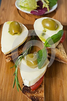 Bruschetta with tomato, mozarella and olive