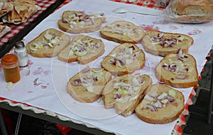 bruschettas with garlic extra virgin olive oil and pieces of cooked onion for sale