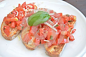 Bruschette with tomato, cheese and basil