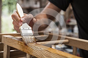 Brush applying varnish