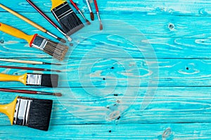 Brush on a blue wooden textured table