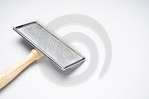 Brush for dogs on a white background, space for text. Grooming brush. Flat lay