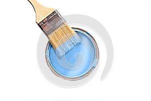 The brush in the paint blue color and the can with paint blue color isolated on white background