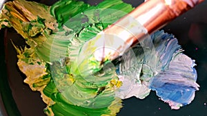 Brush painting blue green blending color. Acrylic paint close up macro view brushstroke fragment on artwork illustration
